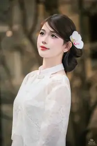 Elegant Asian Beauty: A Gentle Girl Adorned with a Pure White Orchid-0