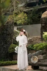 Elegant Asian Beauty: A Gentle Girl Adorned with a Pure White Orchid-10