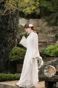 Elegant Asian Beauty: A Gentle Girl Adorned with a Pure White Orchid-6