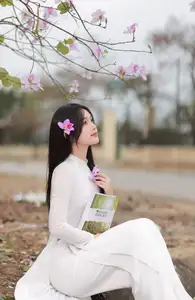 Elegant Vietnamese Student in Ao Dai Amidst Bauhinia Flowers-7