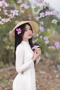 Elegant Vietnamese Student in Ao Dai Amidst Bauhinia Flowers-8