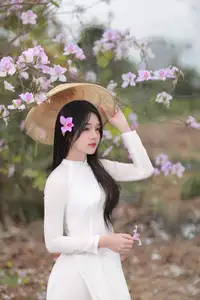 Elegant Vietnamese Student in Ao Dai Amidst Bauhinia Flowers-5