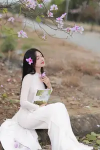 Elegant Vietnamese Student in Ao Dai Amidst Bauhinia Flowers-1