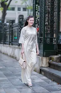 VGU No.162: Modern Ao Dai Grace: Vietnamese Woman's Elegant Style & Allure on City Streets.-0