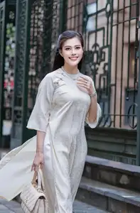 VGU No.162: Modern Ao Dai Grace: Vietnamese Woman's Elegant Style & Allure on City Streets.-6