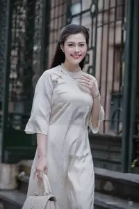 VGU No.162: Modern Ao Dai Grace: Vietnamese Woman's Elegant Style & Allure on City Streets.-1