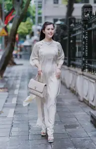 VGU No.162: Modern Ao Dai Grace: Vietnamese Woman's Elegant Style & Allure on City Streets.-4