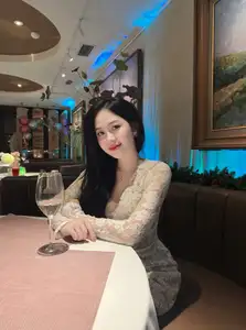 Captivating Beauty: Young Woman in Elegant Lace Dress Shines in Luxurious Restaurant Setting.-3