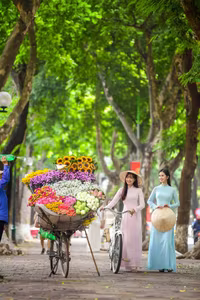 XVG No.23: Enchanting Vietnamese Ao Dai Beauty with Vibrant Flower Bicycle on a Green Street-11
