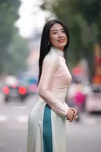 Graceful Vietnamese Lady in Traditional Ao Dai  1000024954-9