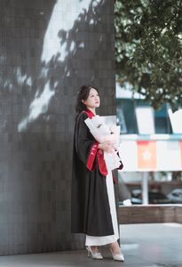 Radiant Student in Graduation Gown Captures Memorable Moment of Success and Joy for a Bright Future.-11