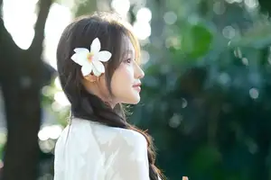 Pure Charm: White-Dressed Girl Winking Playfully with White Flowers 1000024585-5