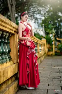 Elegant Asian Beauty in Red Dress Shines Gracefully Amidst a Traditional Garden 1000024509-9