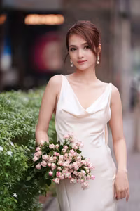 VGU No.11: Elegant Charm: A Woman's Grace in White Gown and Delicate Rose Bouquet-7