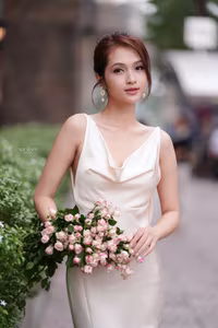VGU No.11: Elegant Charm: A Woman's Grace in White Gown and Delicate Rose Bouquet-13