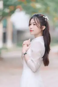 Discover the Elegant Beauty of a Vietnamese Young Woman in White Áo Dài 1000026883-0