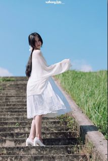 Serene Young Woman in Sunlight, Blue Sky & Nature | Capturing Human Beauty Amidst Natural Scenery-0