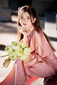 Captivating Serenity: Vietnamese Girl in Pink Ao Dai with Lotus Flowers1730591-32