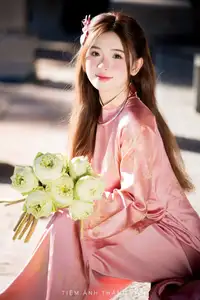 Captivating Serenity: Vietnamese Girl in Pink Ao Dai with Lotus Flowers1730591-27