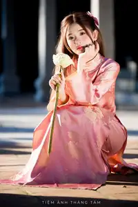 Captivating Serenity: Vietnamese Girl in Pink Ao Dai with Lotus Flowers1730591-8