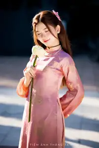 Captivating Serenity: Vietnamese Girl in Pink Ao Dai with Lotus Flowers1730591-1