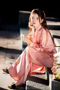 Captivating Serenity: Vietnamese Girl in Pink Ao Dai with Lotus Flowers1730591-21