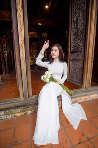 VGU No.69: Graceful Vietnamese beauty in pristine white Ao Dai with pure lotus, exuding captivating Asian charm.-2