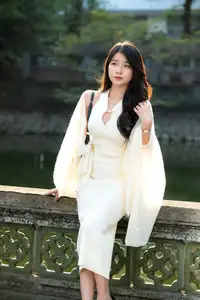Elegant Beauty in Pristine White Dress Under Golden Afternoon Sun 1000027006-1