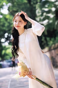 VGU No.131: Graceful young woman in traditional dress, timeless Vietnamese beauty against ancient brick.-3