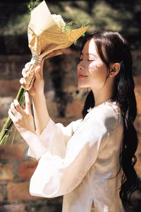 VGU No.131: Graceful young woman in traditional dress, timeless Vietnamese beauty against ancient brick.-8