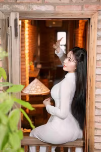 VGU No.108: Pristine White Ao Dai Elegance A Graceful Vietnamese Woman in Traditional Setting-6