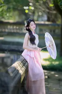 Discover the gentle charm of an Asian beauty in elegant attire, exuding grace and allure 1000025175-1