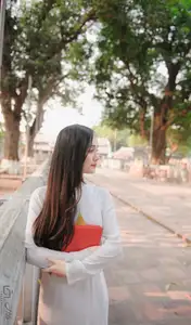 Graceful Vietnamese Girl in White Ao Dai, Radiant Smile at Ancient Site 1000026917-15