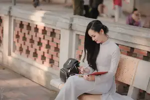 Graceful Vietnamese Girl in White Ao Dai, Radiant Smile at Ancient Site 1000026917-14