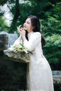VGU No.131: Explore the Ethereal Beauty of a Vietnamese Lady in White Ao Dai with Lilies-3
