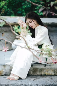 VGU No.131: Explore the Ethereal Beauty of a Vietnamese Lady in White Ao Dai with Lilies-1