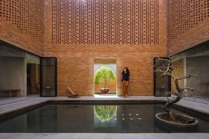 Astonishing architecture of the sloped roof house in Long An resembling a brick kiln hiding unique interior spaces-9