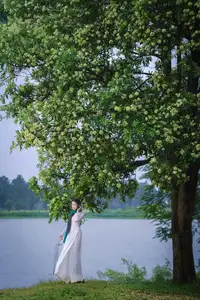 VGU No.172: Captivating Vietnamese Ao Dai Student in a Dreamy Moment, Showcasing Pure Grace Amidst Nature.-14