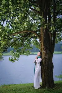 VGU No.172: Captivating Vietnamese Ao Dai Student in a Dreamy Moment, Showcasing Pure Grace Amidst Nature.-8