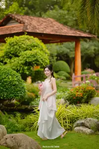 Graceful Young Woman in a Dreamy Garden: A Serene and Elegant Moment 1000025211-5