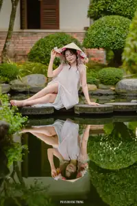 Graceful Young Woman in a Dreamy Garden: A Serene and Elegant Moment 1000025211-12