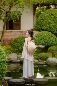 Graceful Young Woman in a Dreamy Garden: A Serene and Elegant Moment 1000025211-4