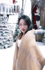 Radiant Beauty: Girl in Pristine White Dress Amidst Romantic Winter Wonderland 1000024890-5